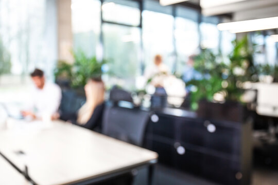 Blurred office background with employees