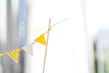 decorative white and yellow paper flags