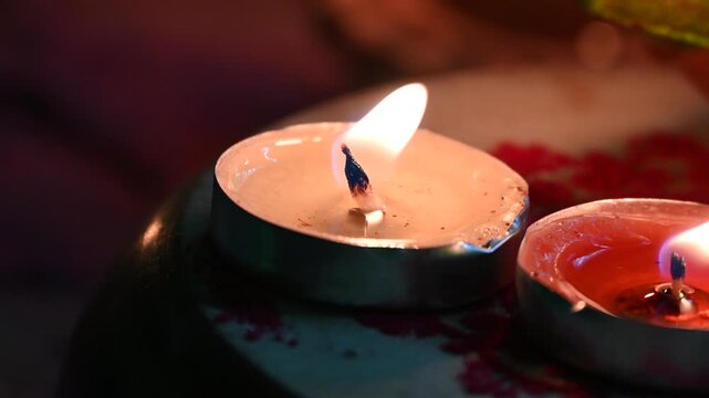 Happy Diwali - Clay Diya lamps lit during Diwali, Hindu festival of lights celebration. Colorful traditional oil lamp diya on red background Diwali celebration Indian festival of lights Diya oil lamp