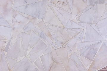 Abstract background of laying pieces of marble in various shapes for garden paths. texture. Sample marble texture and construction work. A copy space.