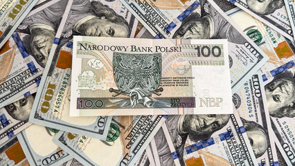 Polish Zloty Banknote on US Dollar Bills – Currency Exchange and International Finance