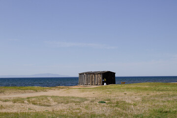 old wooden boathouse on the shore of Lake Baikal