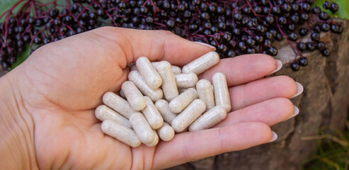 Elderberry and Capsules for Immunity in Hand