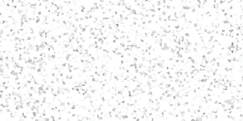 Abstract background texture featuring a dense arrangement of small, irregular grey and white geometric polygons in a subtle mosaic pattern for design use