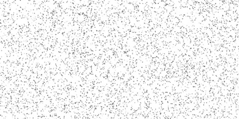 Dense monochromatic speckled texture background with a high concentration of small irregular geometric shapes in shades of grey on a white base