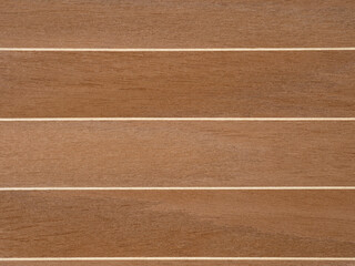 Warm walnut veneer with crisp white inlays presents a modern linear design