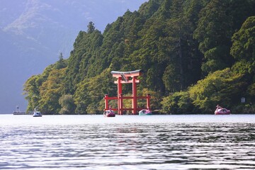 Several swan boats floating on Lake Ashi in Hakone