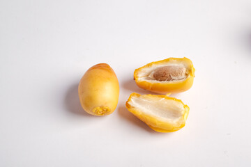 Yellow tropical fruit with seed
