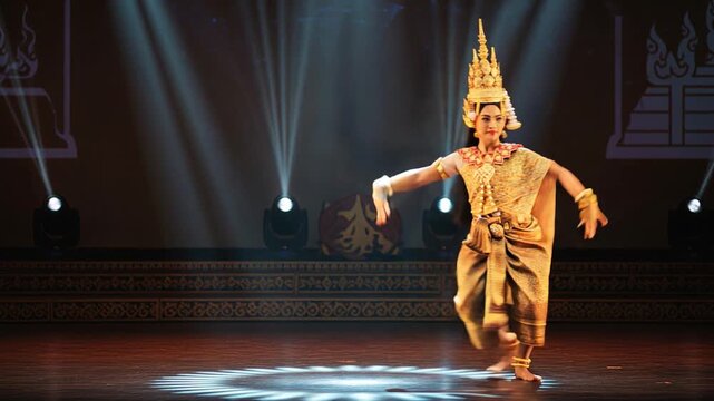 Elegant Apsara Dancer Performing Traditional Khmer Dance on Stage with Spotlights