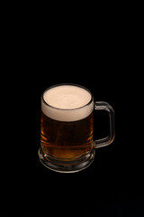 Beer mug on black background – studio glassware