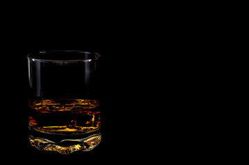 Glass on black background – minimalist studio glassware