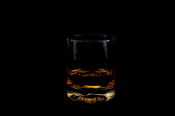 Glass on black background – minimalist studio glassware