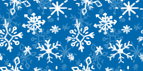 Seamless pattern with cute hand drawn snowflakes in doodle style. Blue winter wallpaper, charcoal texture, ornate child drawings. Decoration, background for Christmas, New Year designs, greeting card.