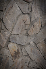Weathered gray stone vertical wall background northern style
