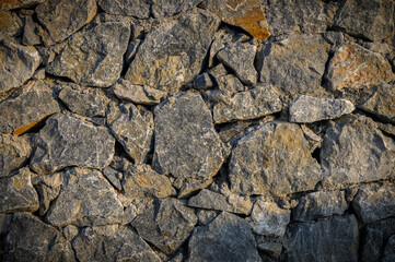 Warm yellow stone wall texture for background