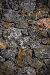 Cold gray natural stone wall vertical background