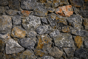 Cold gray natural stone wall background texture