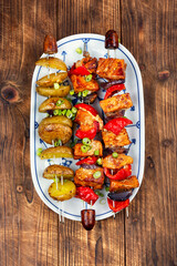 Grilled meat skewers with potatoes.