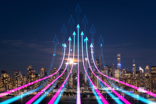 Neon arrows rising upward over illuminated USA cityscape at night representing technology growth and progress concept on a futuristic background.