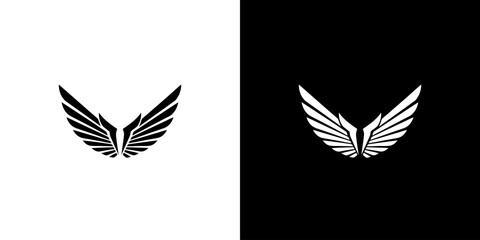 Fototapeta premium A symmetrical graphic design featuring a pair of stylized wings, presented in both black on white and white on black.