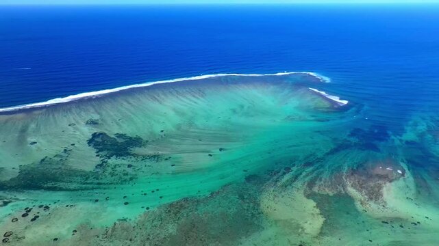 Aerial view of Mauritius island and Le Morne Brabant mountain with beautiful blue lagoon and underwater waterfall illusion background