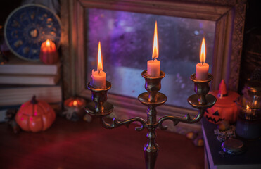 Mystical autumn altar with candles and mirrors