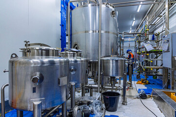 Stainless vertical steel tanks with equipment tank chemical cellar at the with stainless steel tanks cleaning and mixing