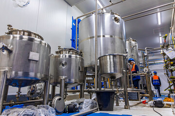 Stainless vertical steel tanks with equipment tank chemical cellar at the with stainless steel tanks cleaning and mixing