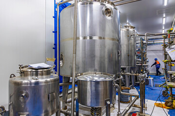 Stainless vertical steel tanks with equipment tank chemical cellar at the with stainless steel tanks cleaning and mixing