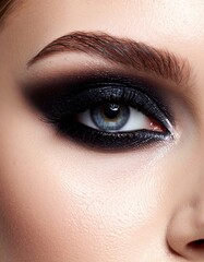 Obraz premium Closeup Woman Eye Makeup Dark Smoky Eyes.