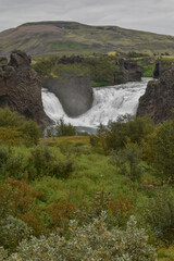 Double waterfall on the river in cloudy weather, landscape