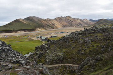 Small village in colorful mountains, rocks and landscape