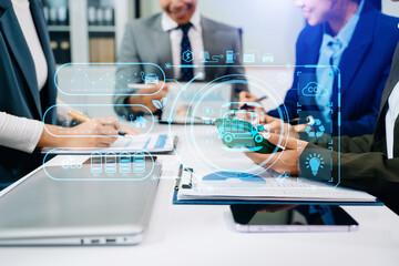 Business team discussing eco innovation and clean energy strategy with digital overlay icons, showcasing electric vehicle technology, sustainability, and smart green solutions.