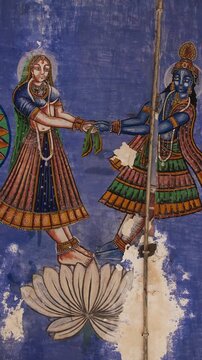 Close-up View on Frescoes Decoration On Wall Of Hanuman Temple In Jaipur, India. Sita And Rama with Sun and Moon. Life Story Of Rama, Sita And Their Companions Allegorically Discusses Duties, Rights