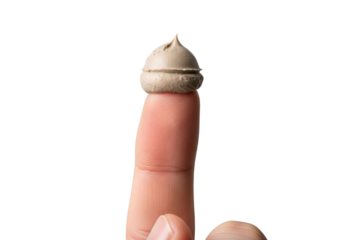 Extreme close-up of a precise, small scoop of neutral matte clay pomade held on a clean male index fingertip, against a blurred transparent background, perfect product demonstration concept