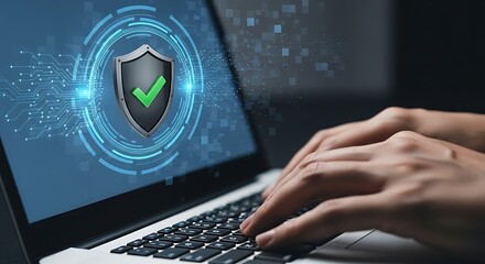 Hands typing on laptop with security shield hologram
