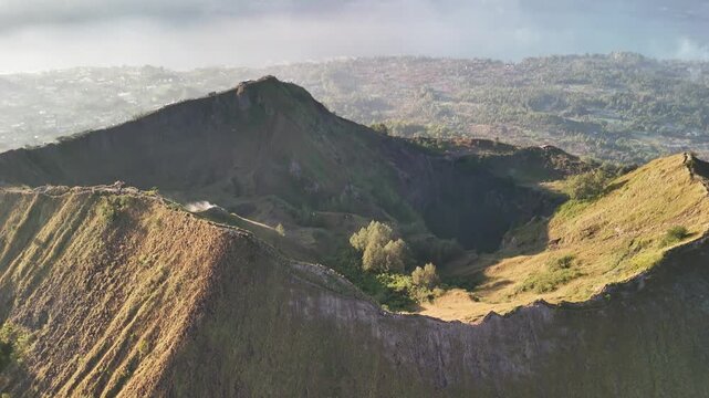 Sunrise drone fly-over of Mount Batur crater ridge, Bali, Indonesia  v3