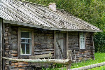 Old wooden house in the village. The house is made of logs.