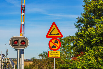 Close-up view of Swedish traffic signs warning of drawbridge with prohibition for cars and motorcycles. Sweden.