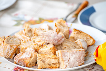 A Plate of Freshly Cut Rustic Bread The Concept of a Shared Meal