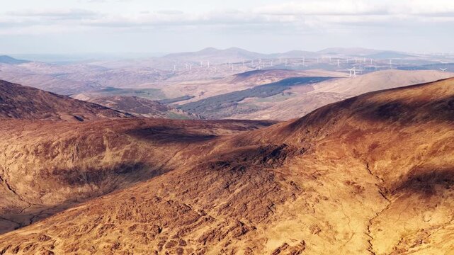 Priest's Leap, Bantry, is a view of the landscape with hills and wind turbines in County Cork, Ireland.