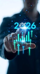 Obraz premium 2026 closeup of a persons finger interacting with a digital display showing the year 2026 and a rising financial chart