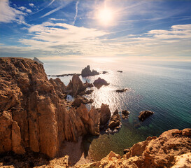 Coastal rocky seascape, view of Praia da Marinha beach in the Algarve region in the Atlantic Ocean on a sunny day, Portugal, Europe