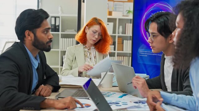 Multiethnic business professionals collaborate in modern office using AI virtual assistant and big data analytics to connect insights, driving strategic innovation through intelligent automation