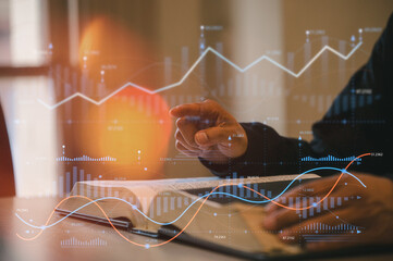 Close-up of businessman hand pointing at data chart overlay with graphs, statistics, and book, symbolizing financial analysis, education, research, stock market, investment, and business strategy.