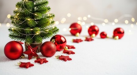 Miniature Christmas tree red ornament star festive holiday winter decoration glowing light joyful mood