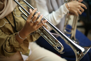 Close Up of Musician Playing Silver Trumpet on rehearsal studio 