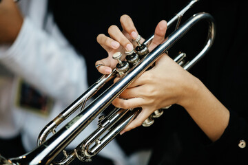 Close Up of Musician Playing Silver Trumpet on rehearsal studio 