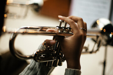Close Up of Musician Playing Silver Trumpet on rehearsal studio 