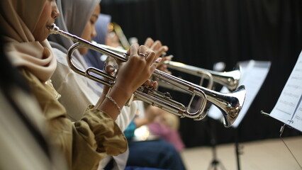 Close Up of Musician Playing Silver Trumpet on rehearsal studio 